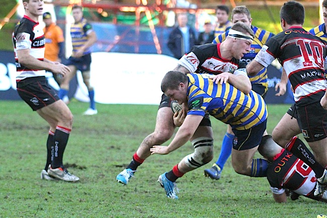 Tom Robertson powers his way through the Pirates defence - Photo: AJF Photography
